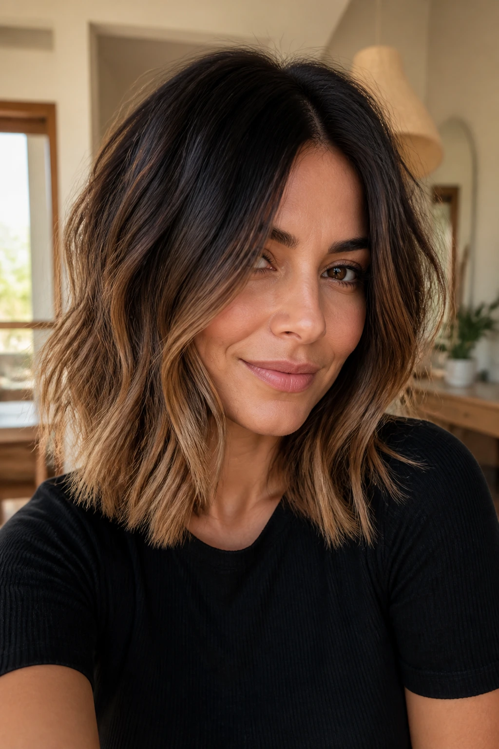 Close-up of a real woman with choppy midi cut and espresso-to-caramel melt