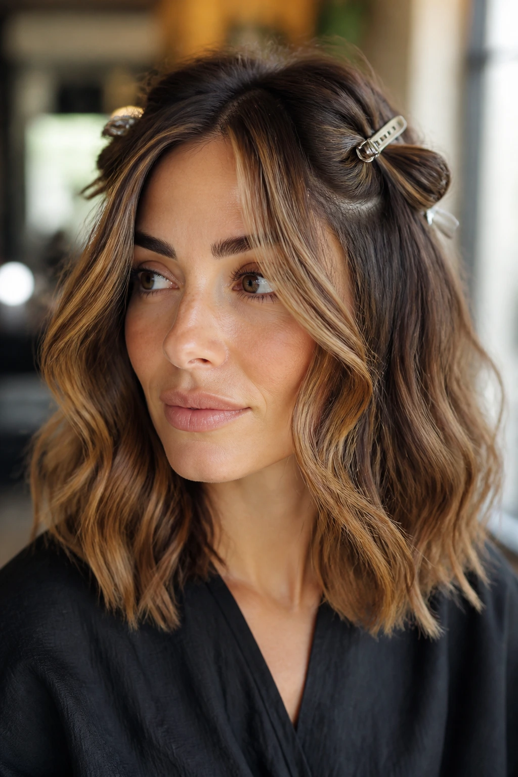 Close-up of face-framing flicks with loose mid-length texture