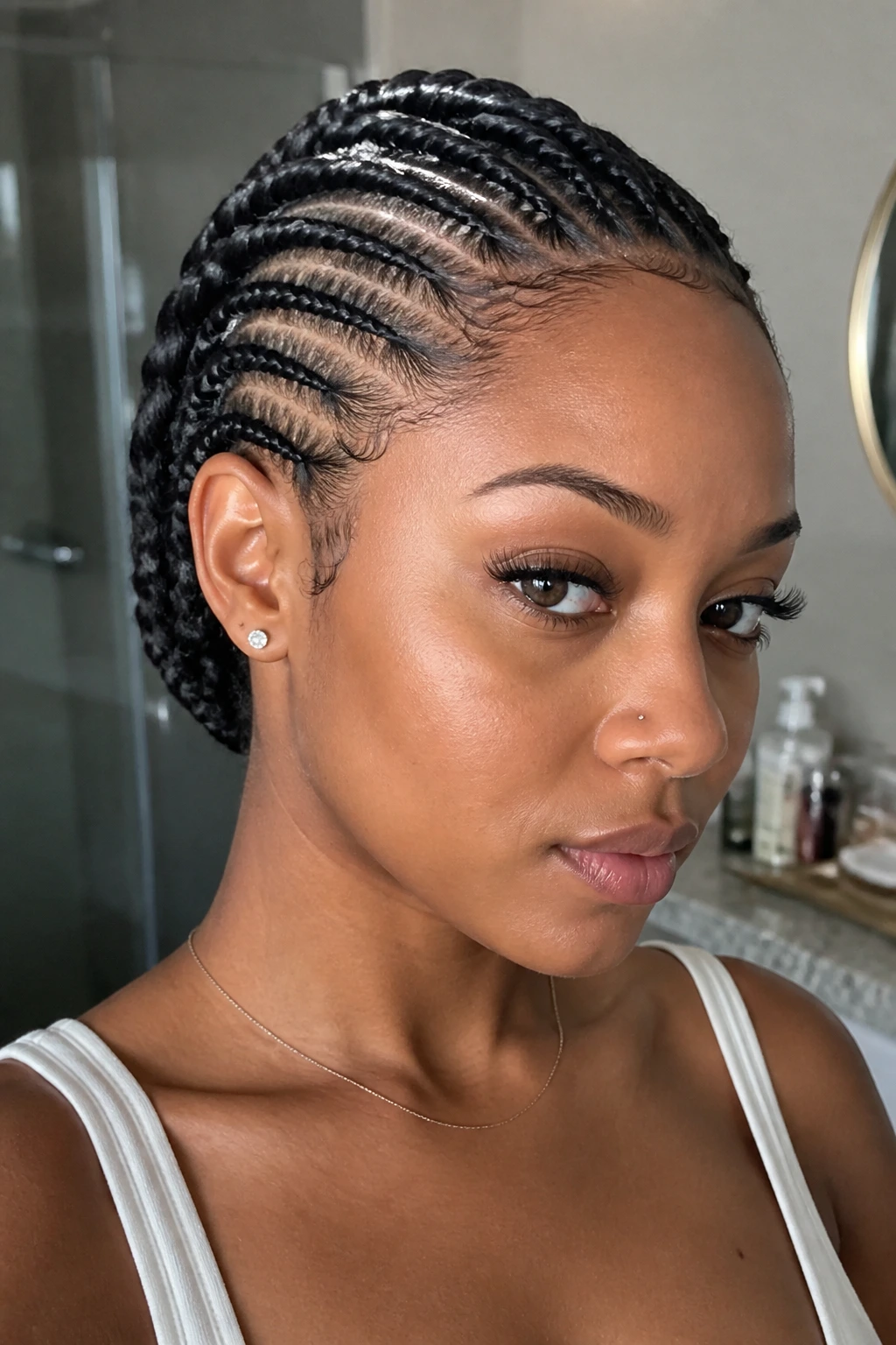Close-up portrait of a person with feed-in flat twists forming a smooth line