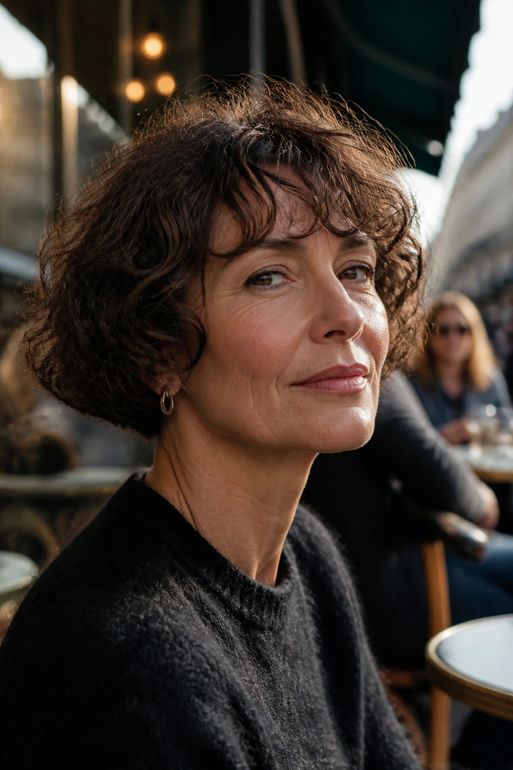 Close-up of a real woman with a French bob and soft curl movement