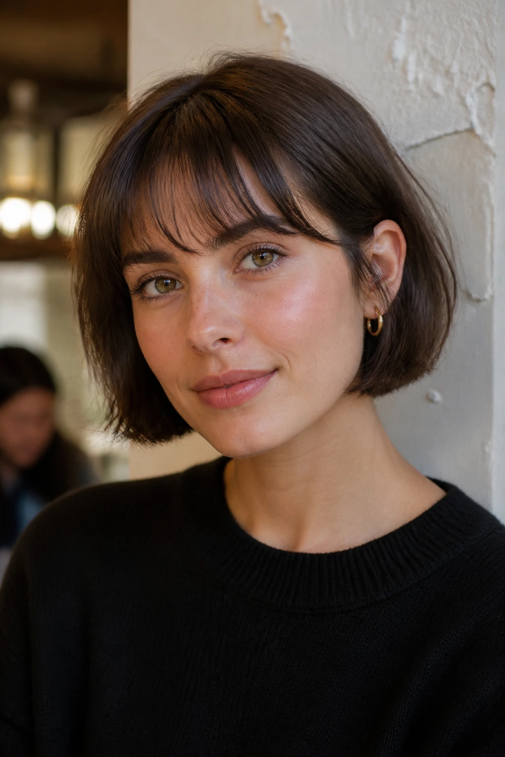 Portrait of a real person in a French bob with a soft fringe.