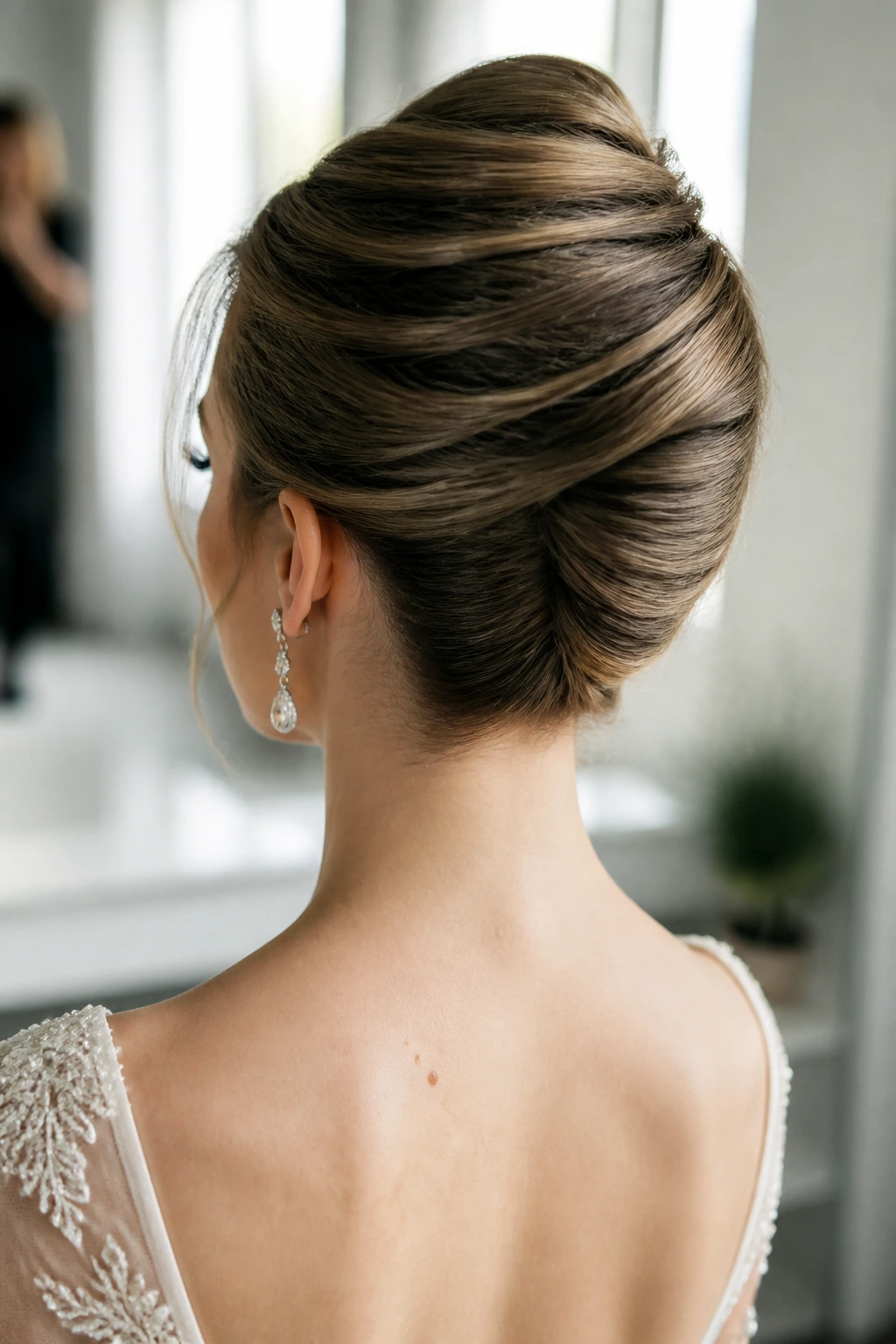 Bride with polished French twist, back view