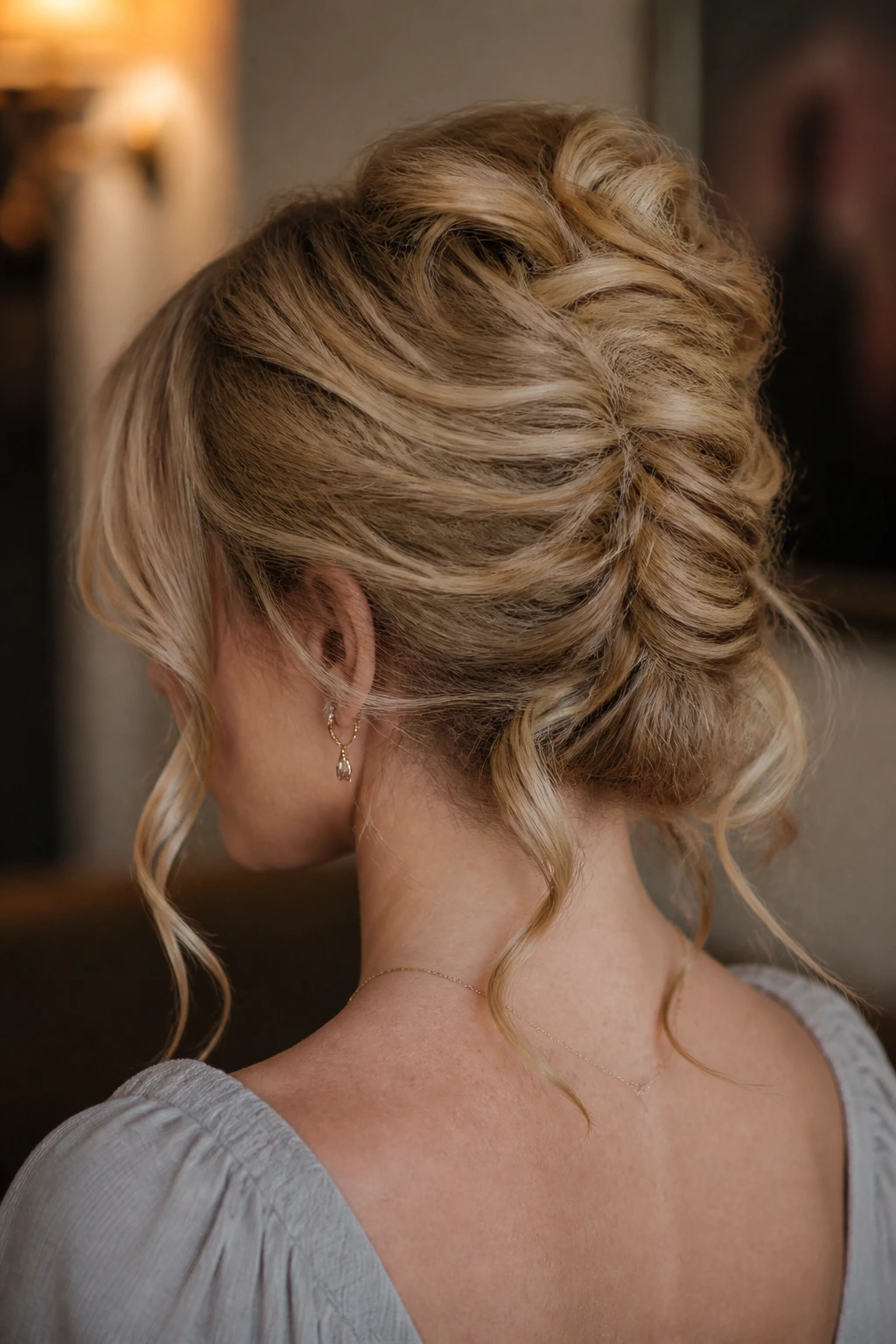 Close-up of a real woman with a French twist and loose ends