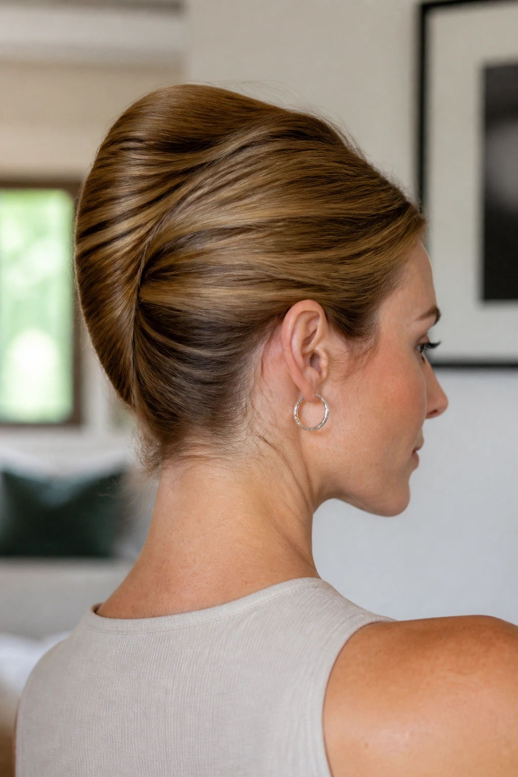 Close-up portrait of a woman with a French twist hairstyle