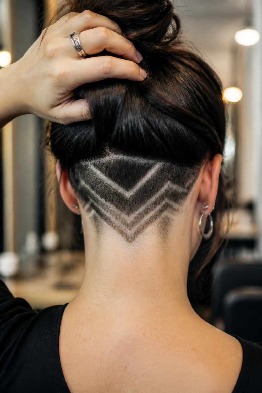 Real woman with geometric nape design visible at the back of the neck