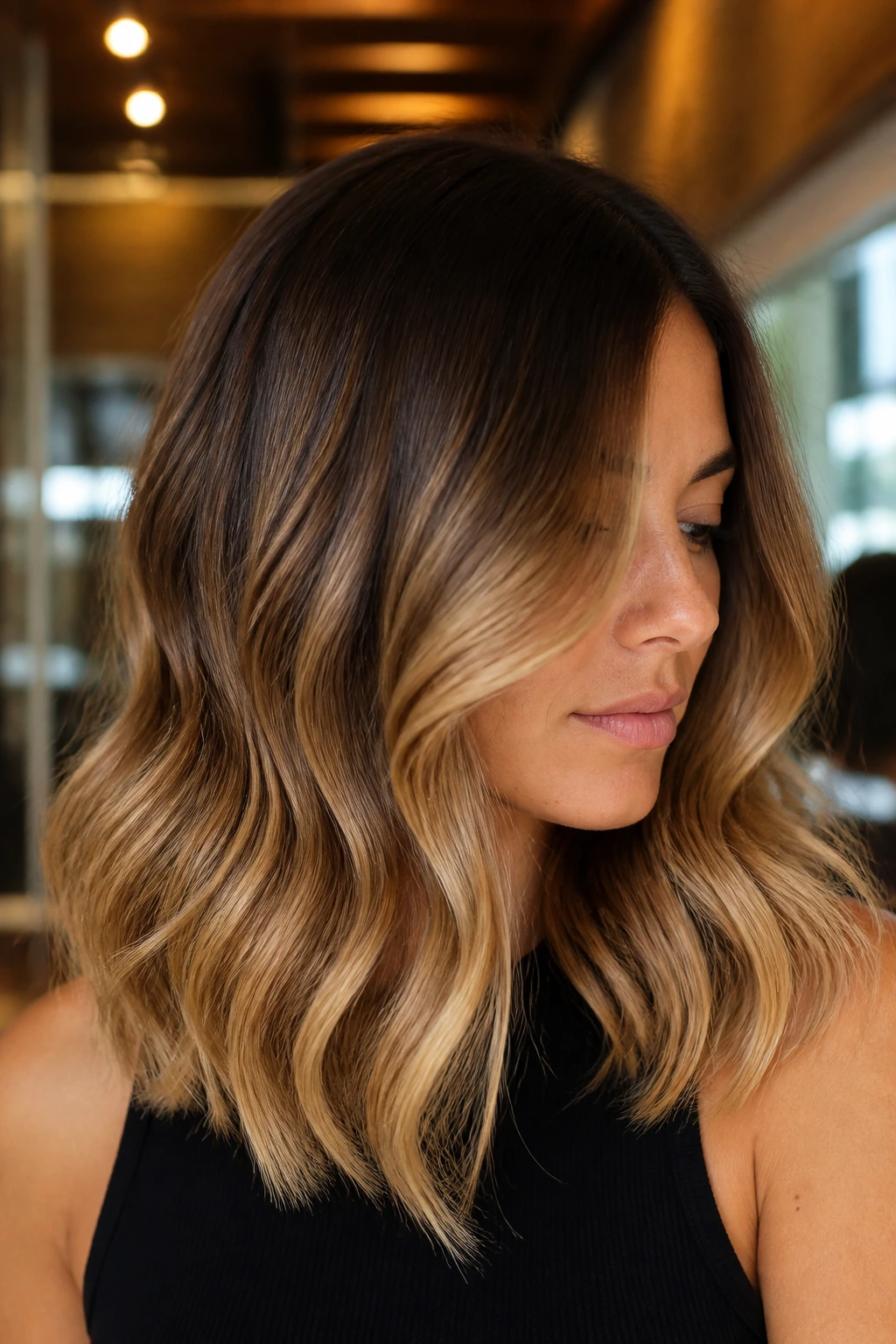 Brunette with golden honey ombré hair gradient