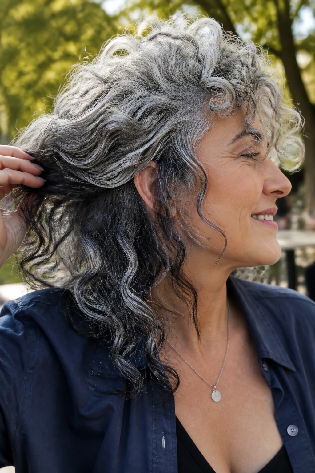 Real woman's curls with graphite peekaboo panels visible during movement