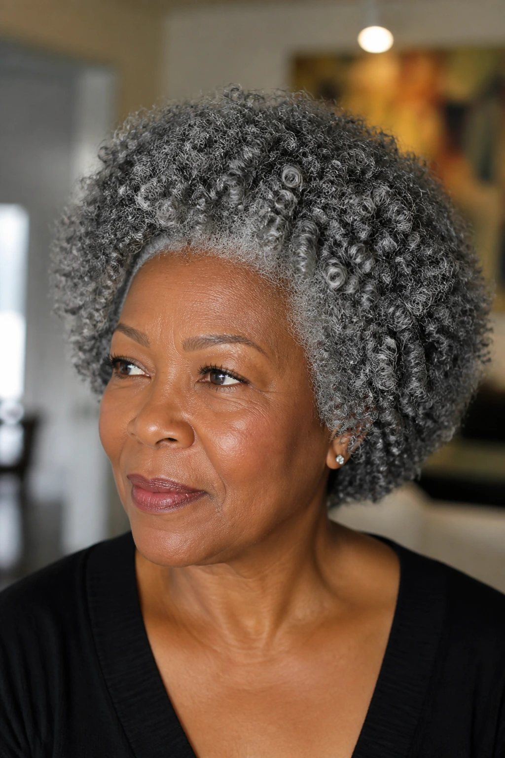 Real woman portrait with gray natural curls in a rounded shape