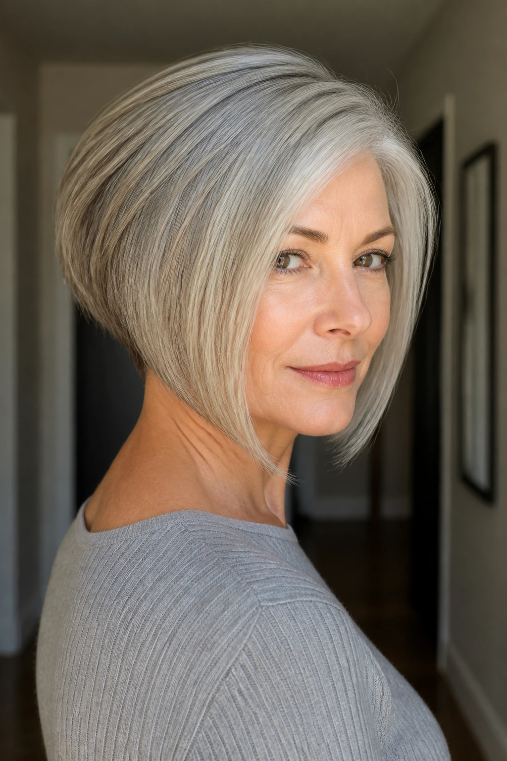 Close-up portrait of a real woman with stacked inverted bob in gray
