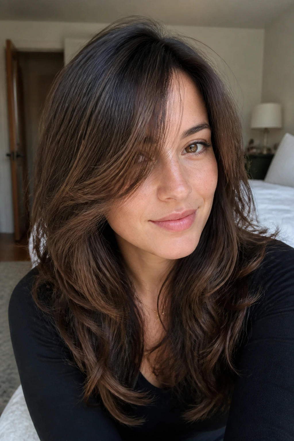 Real person with grow-out swoop blending into layers hairstyle portrait