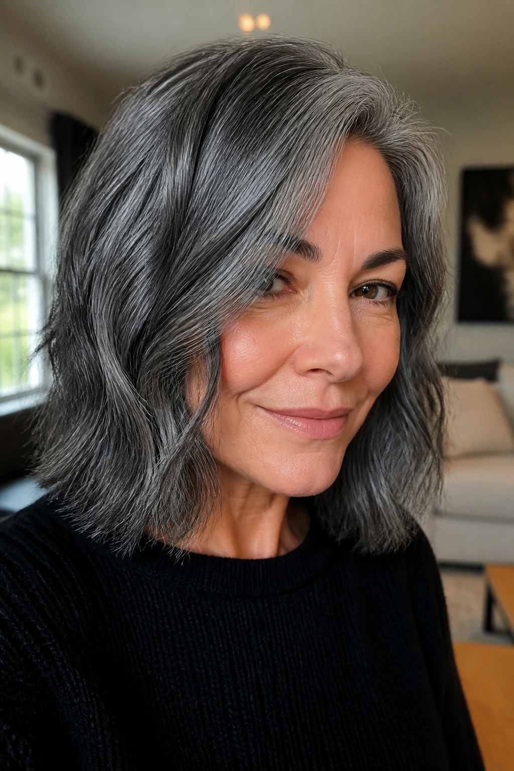Close-up portrait of a real woman with a gunmetal silver lob hairstyle