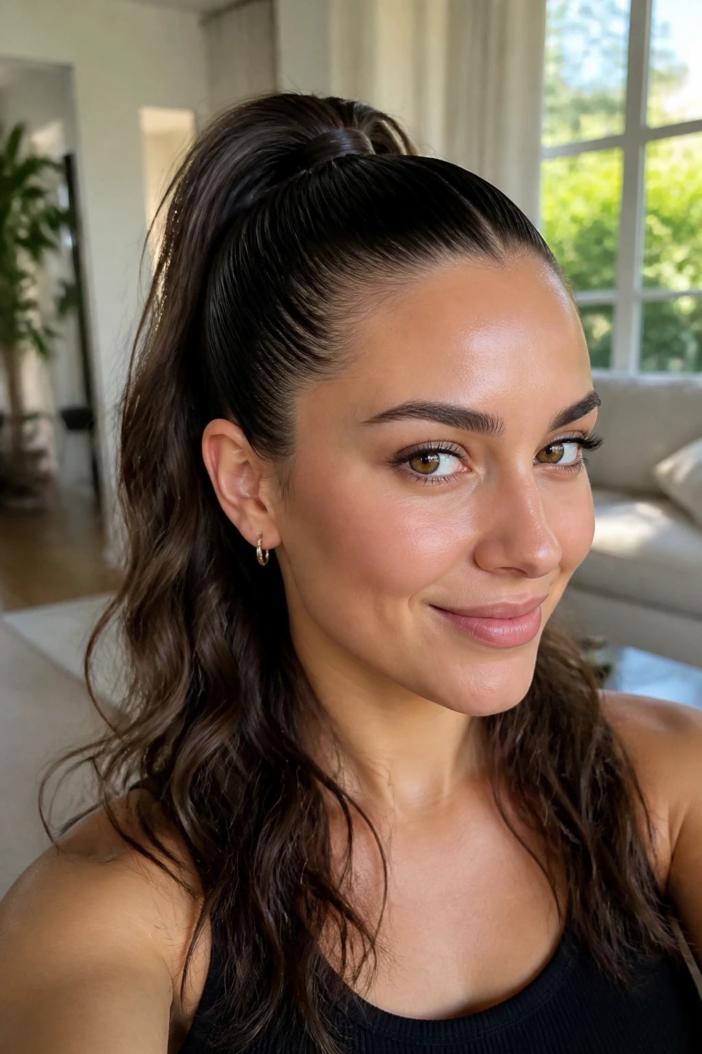 Close-up of a real woman with a half-slick high ponytail showing smooth top and textured lower lengths