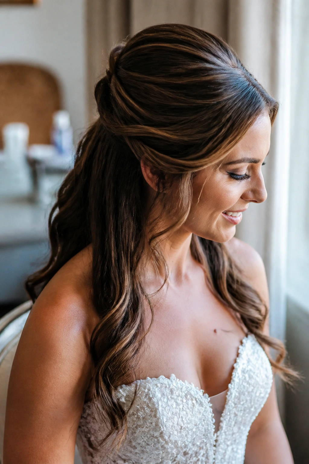 Close-up portrait of a real bride with half-up crown-volume hairstyle