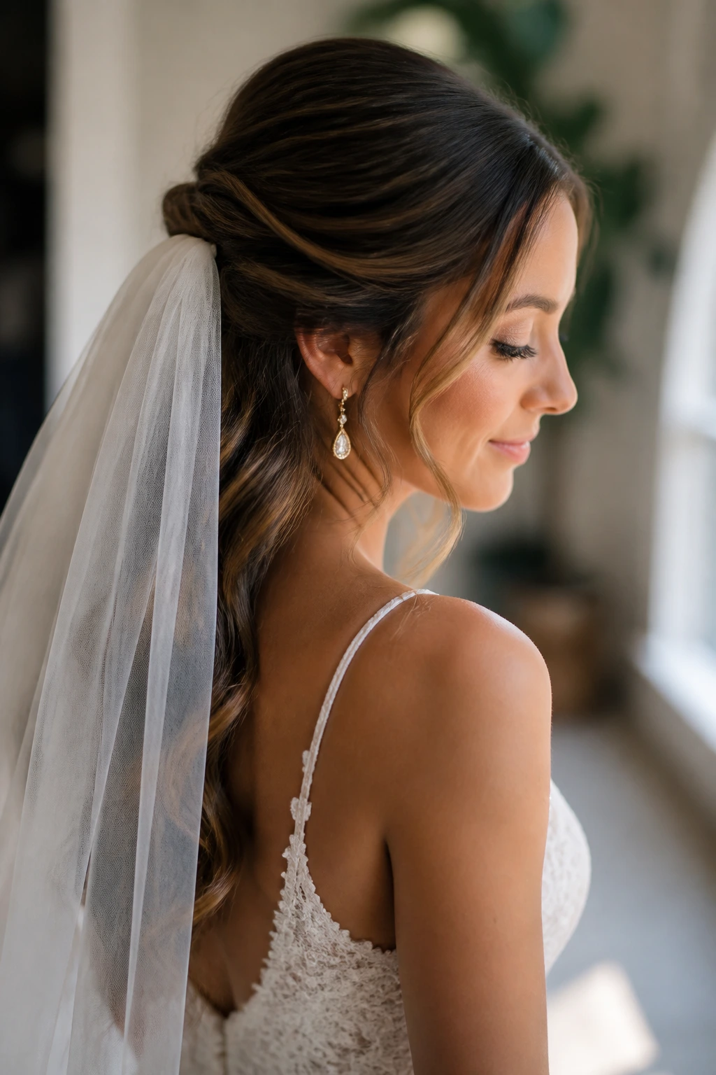 Real bride with half-up twist and veil placement