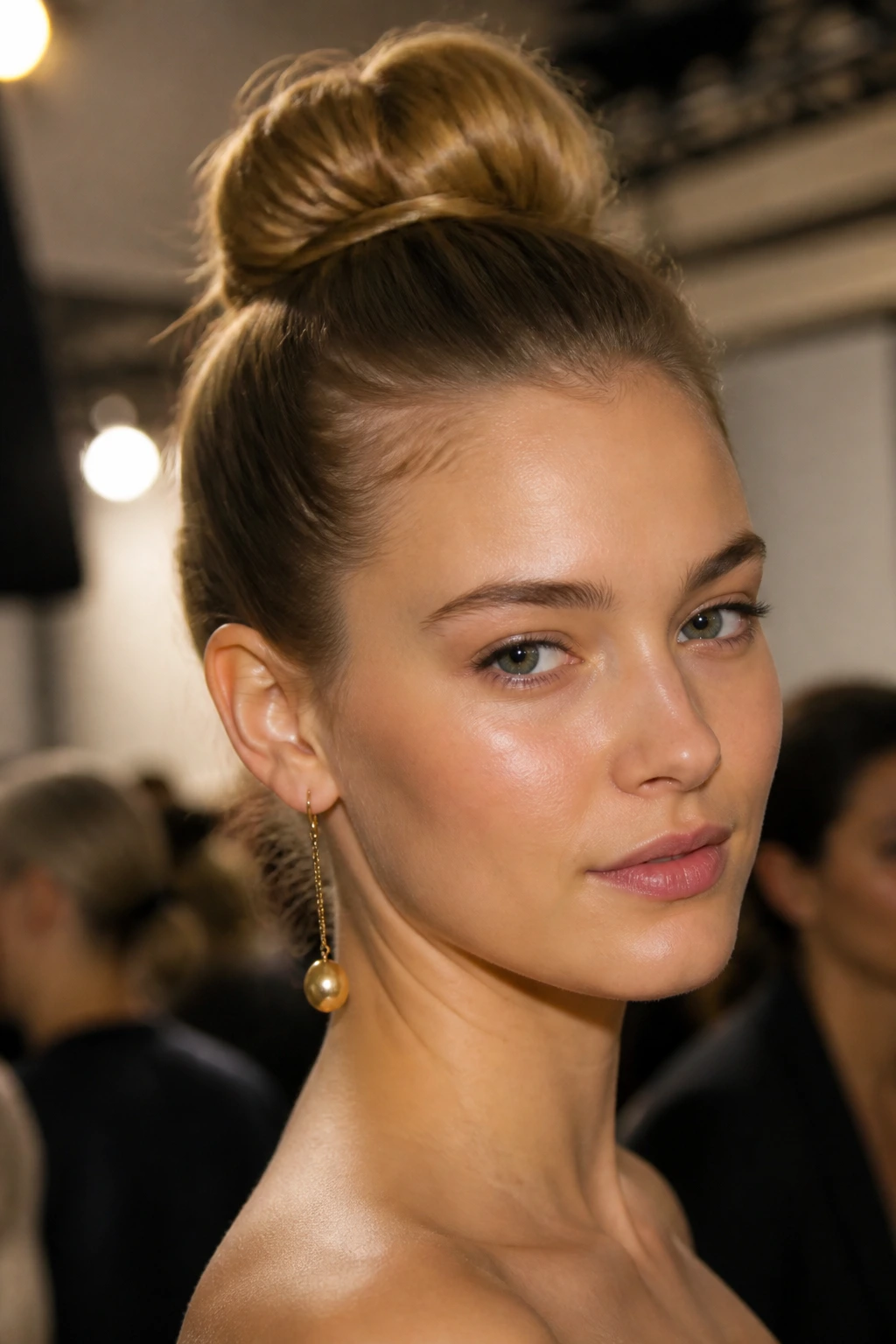 Close-up of a real woman with a high chignon creating dramatic height