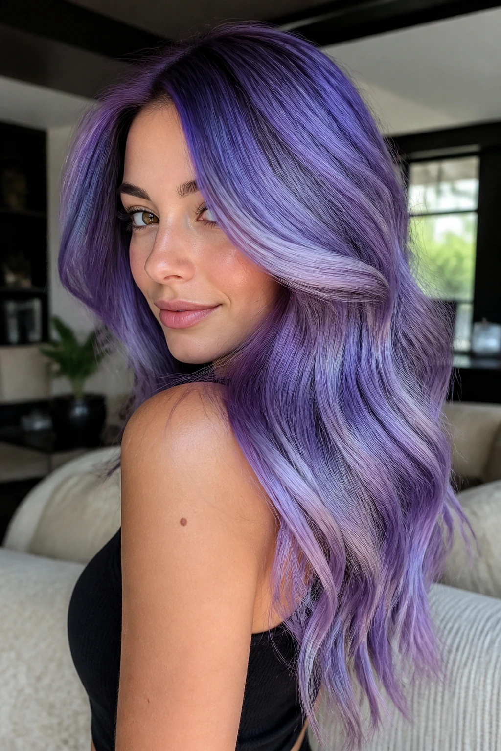 Close-up of a real woman with holographic purple balayage showing iridescent violet and indigo tones