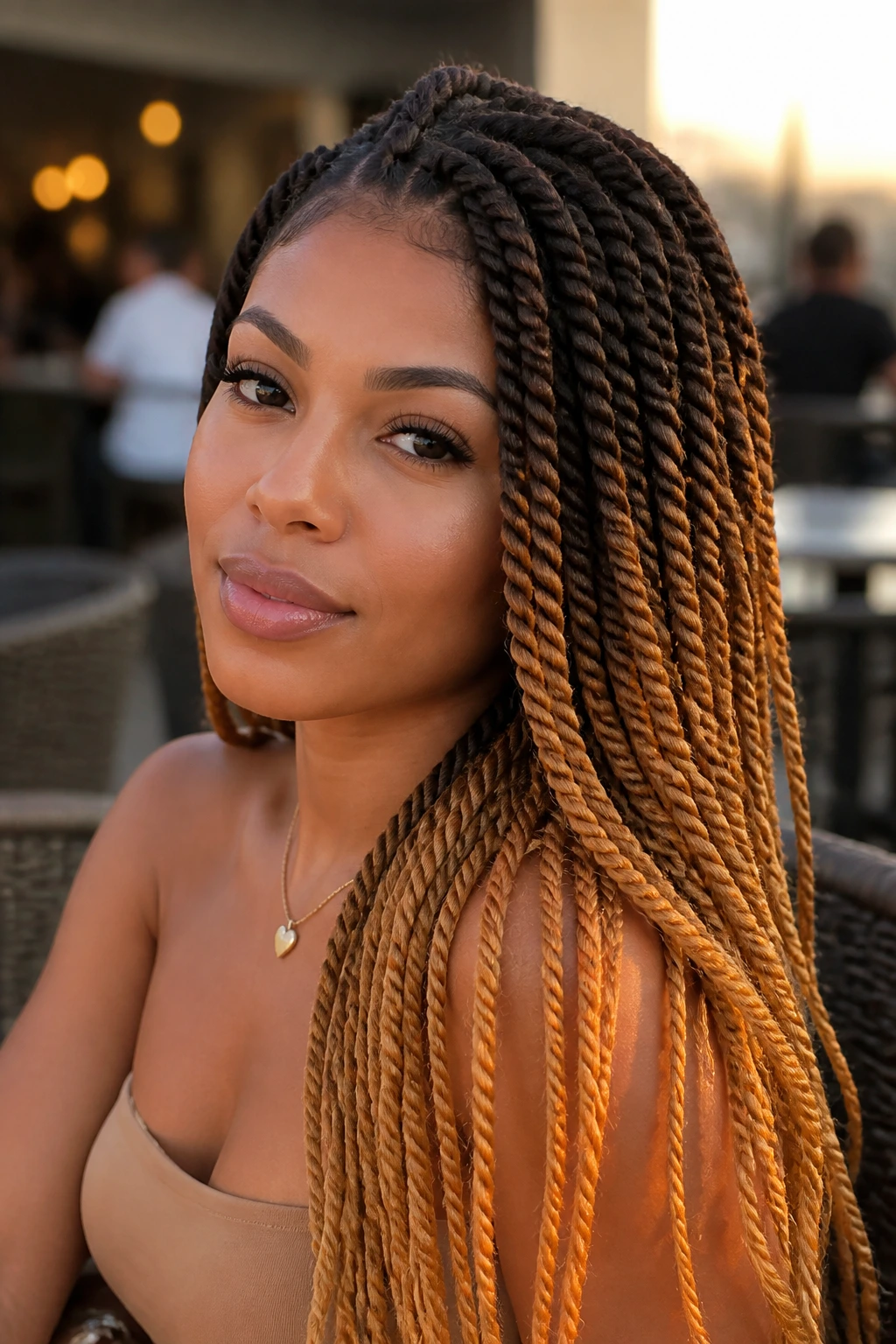 Portrait of a woman with honey-ombre Havana twists