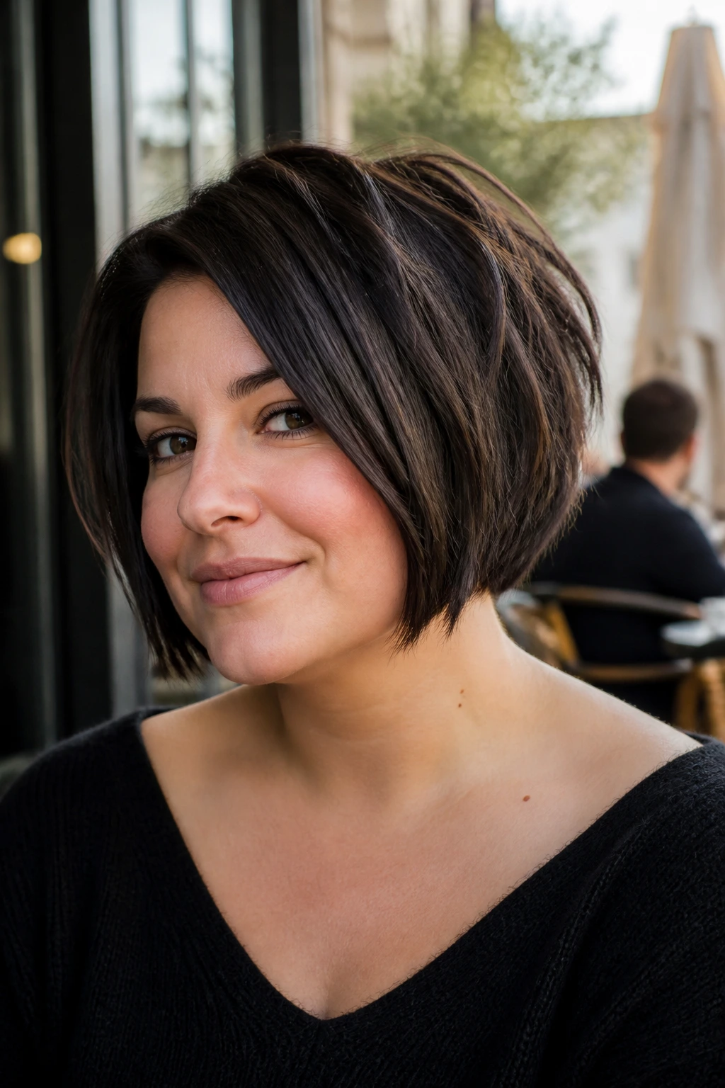 Close-up portrait of a real woman with inverted bob and piecey ends