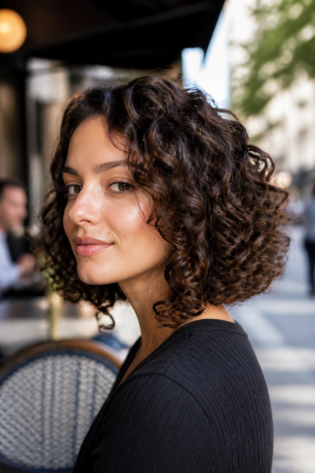 Close-up of a real woman with an inverted curly lob