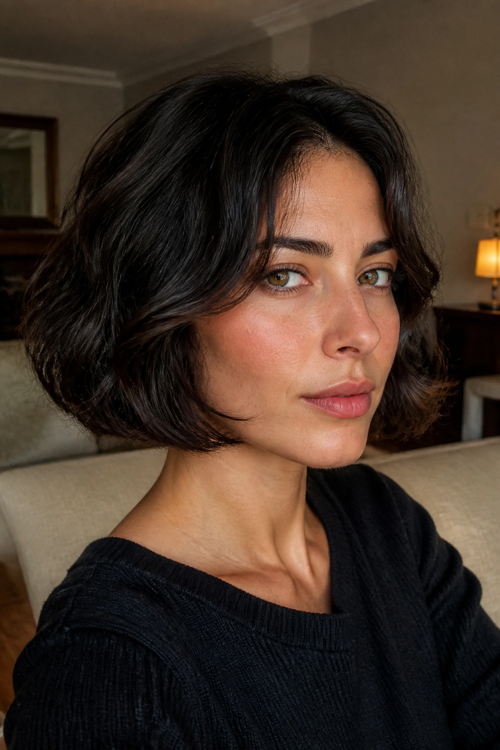Real woman with jawline Italian bob invisible layers in warm living room light