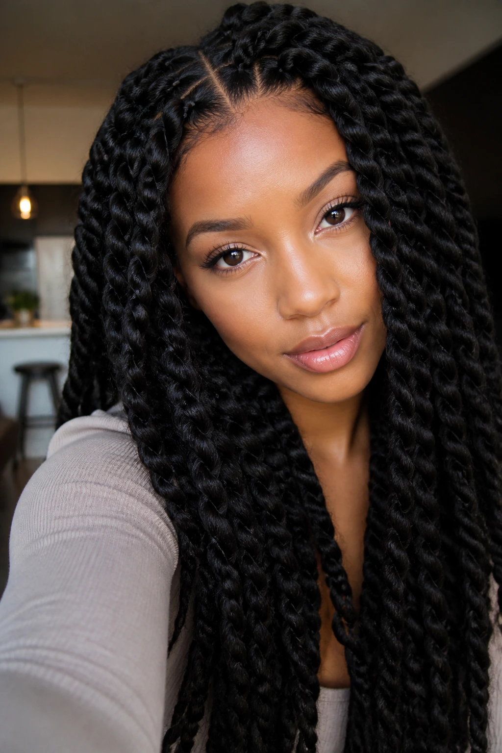 Portrait of a woman with jumbo passion twists
