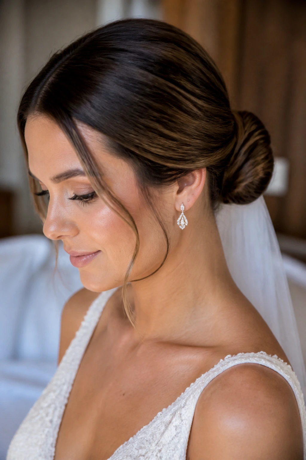 Close-up of a real bride with a minimalist knot bun at the nape