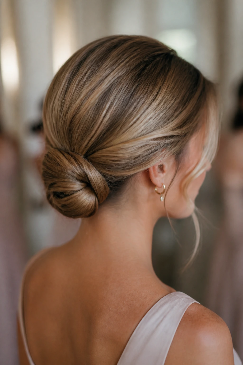 Real woman with knotted low bun at the nape
