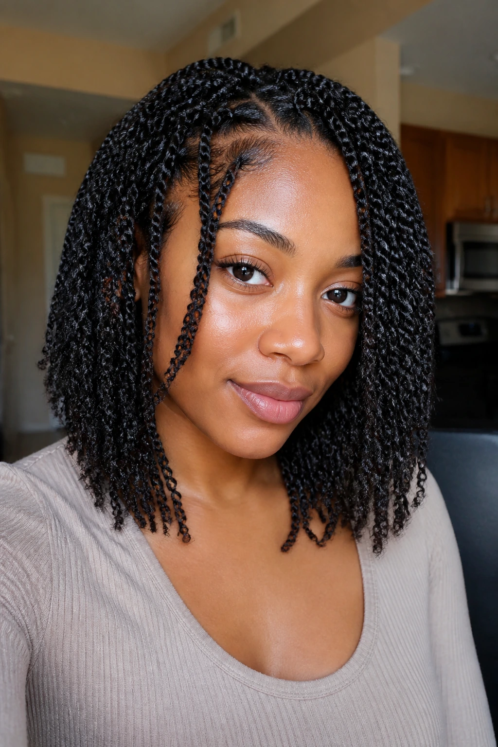 Close-up of a real person with layered face-framing Senegalese twists