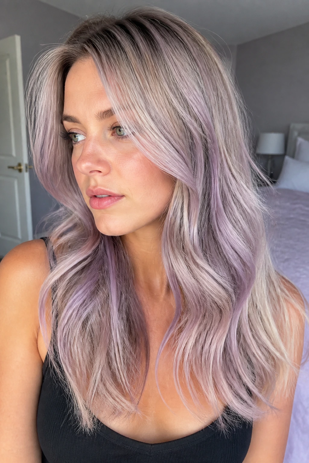 Portrait of a real woman with lilac smudge balayage on pale blonde hair