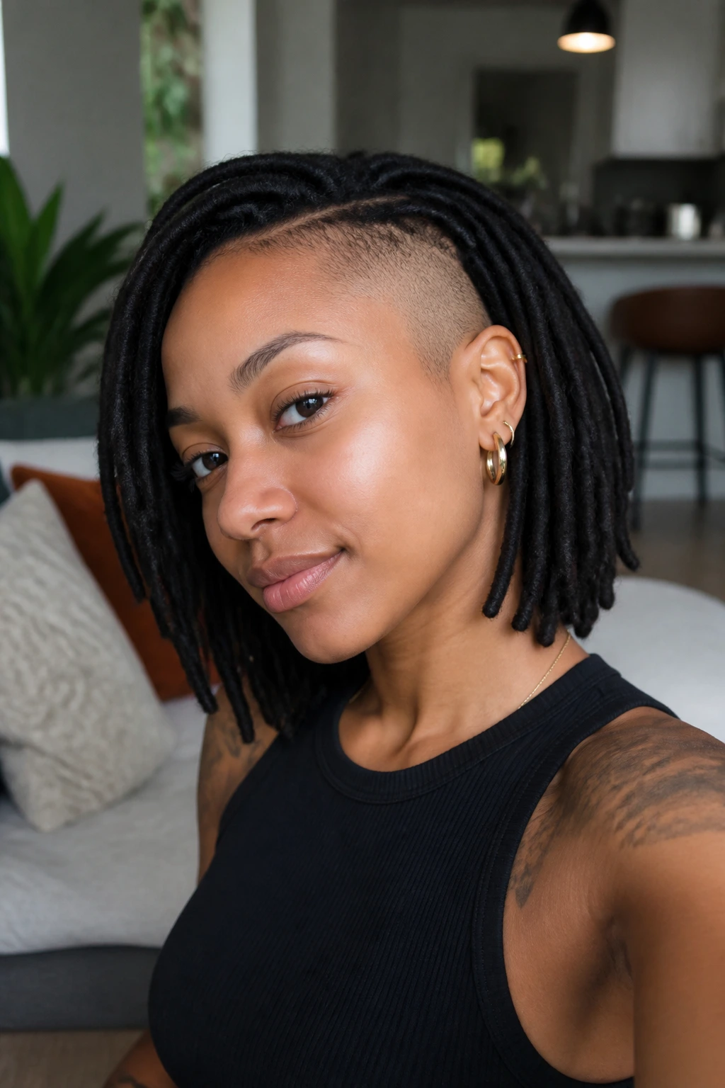 Close-up of a real Black person with loc bob and temple shave