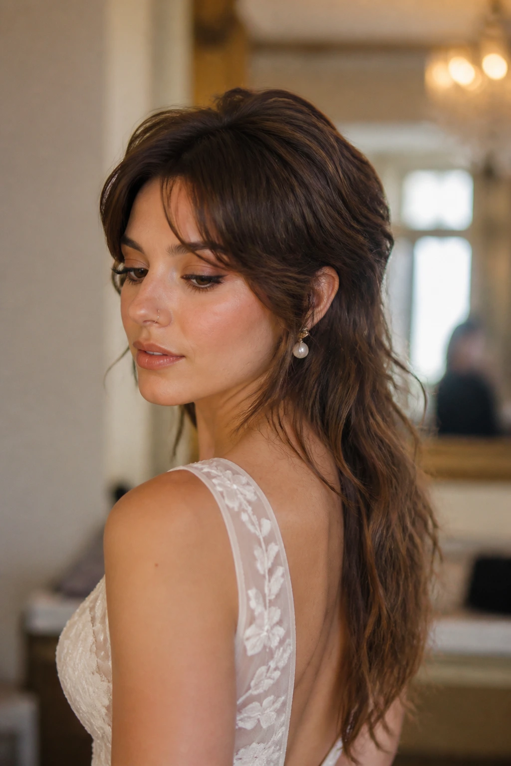 Bride with long-layered low-drama mullet in soft waves.