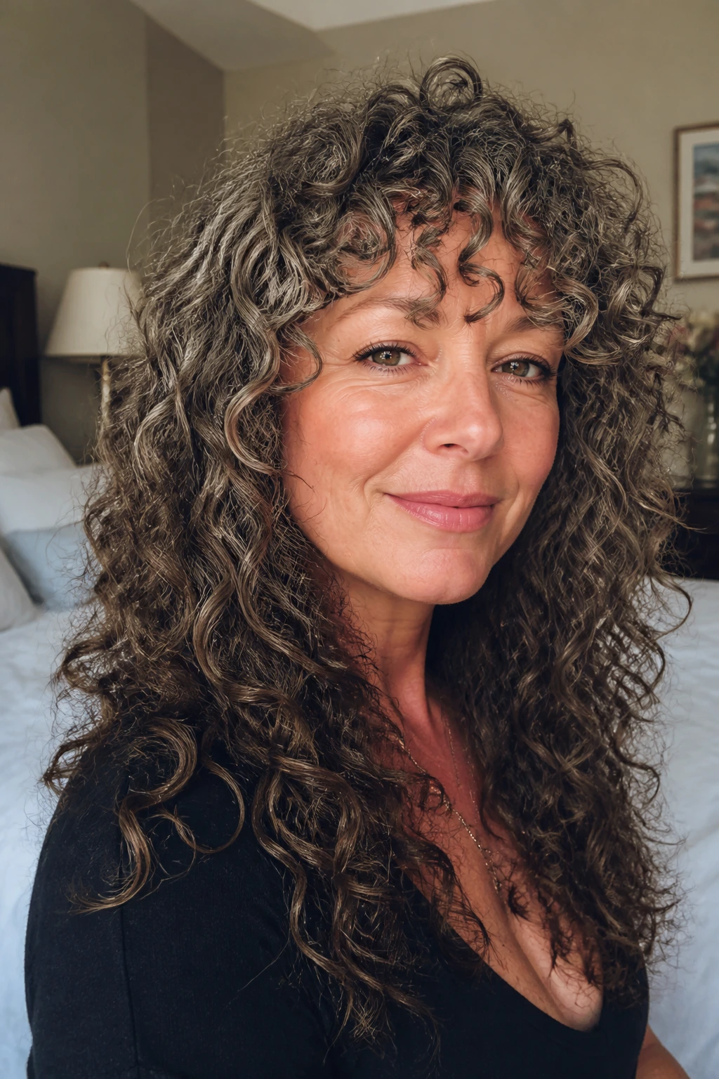 Close-up of real woman with long shag and spiral bangs