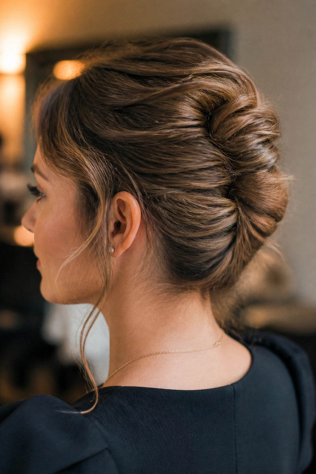 Close-up of a messy French twist at the back of the head