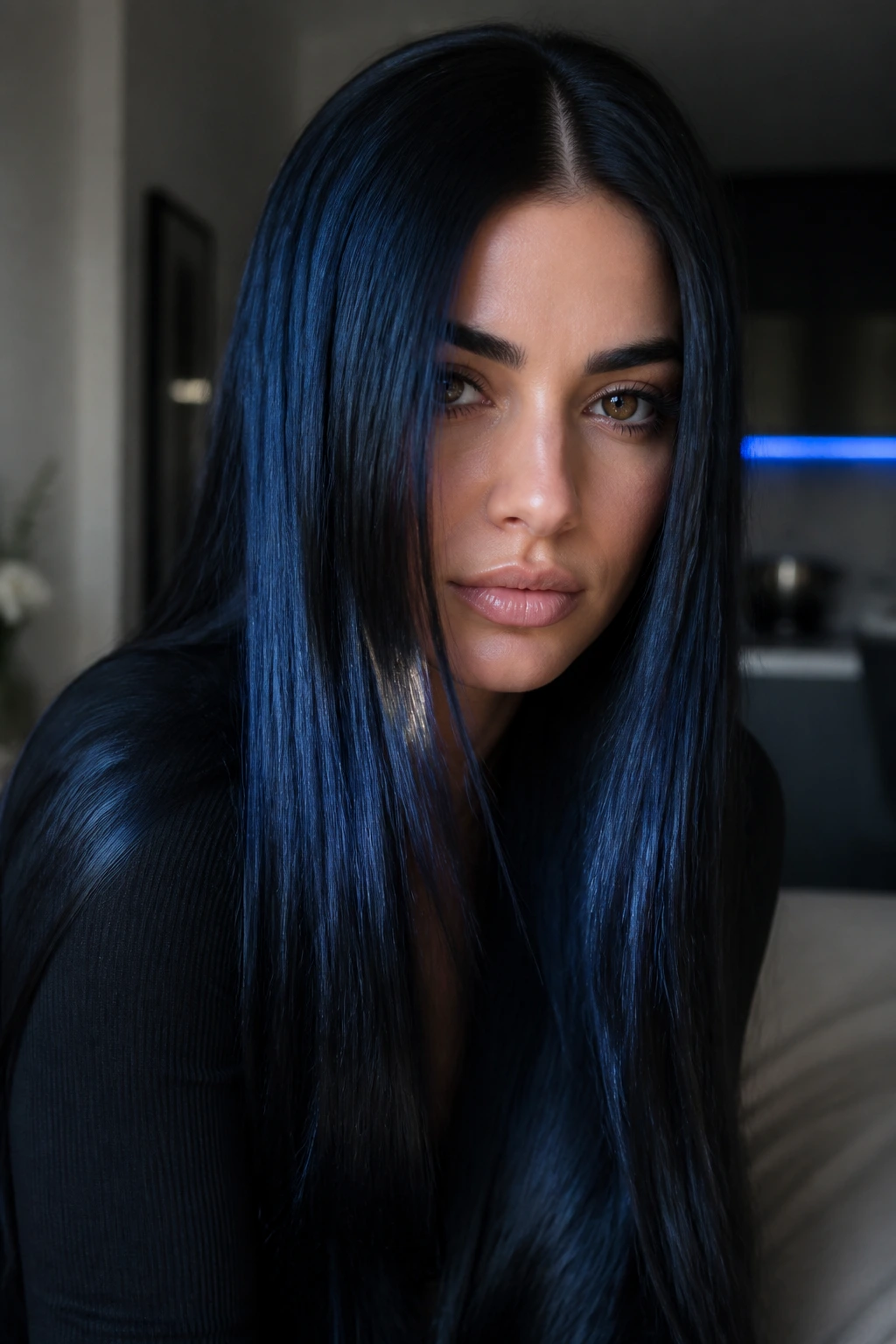 Portrait of a real woman with midnight black hair and blue sheen