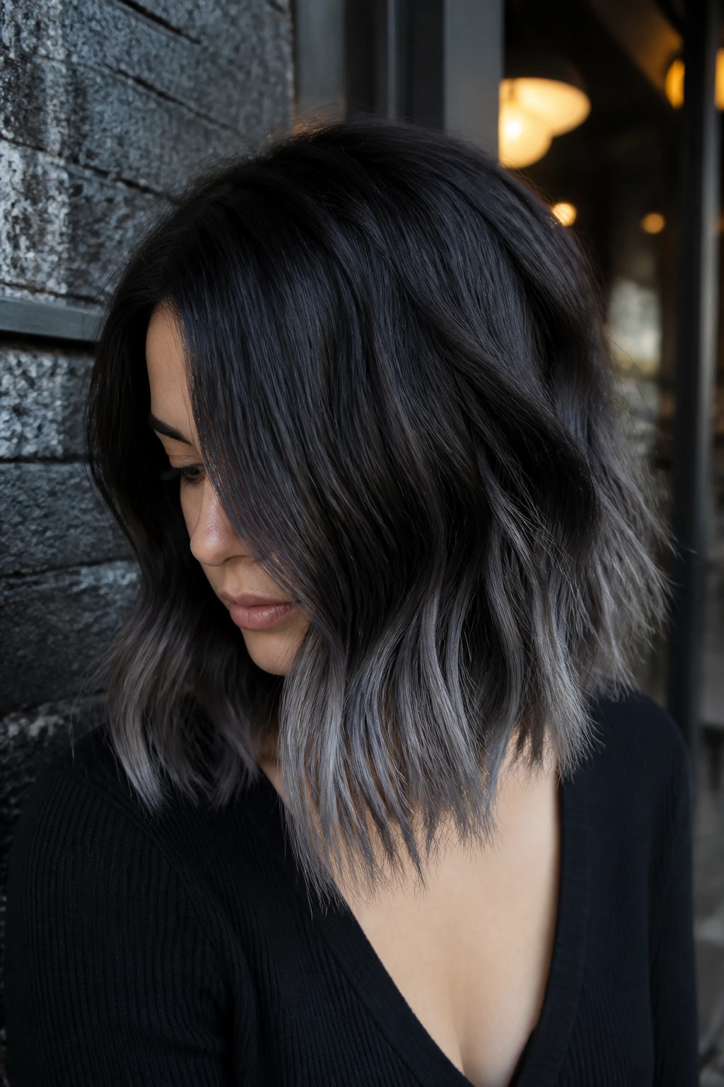 Shoulder-length hair fading from midnight brunette to slate gray ends on a real person