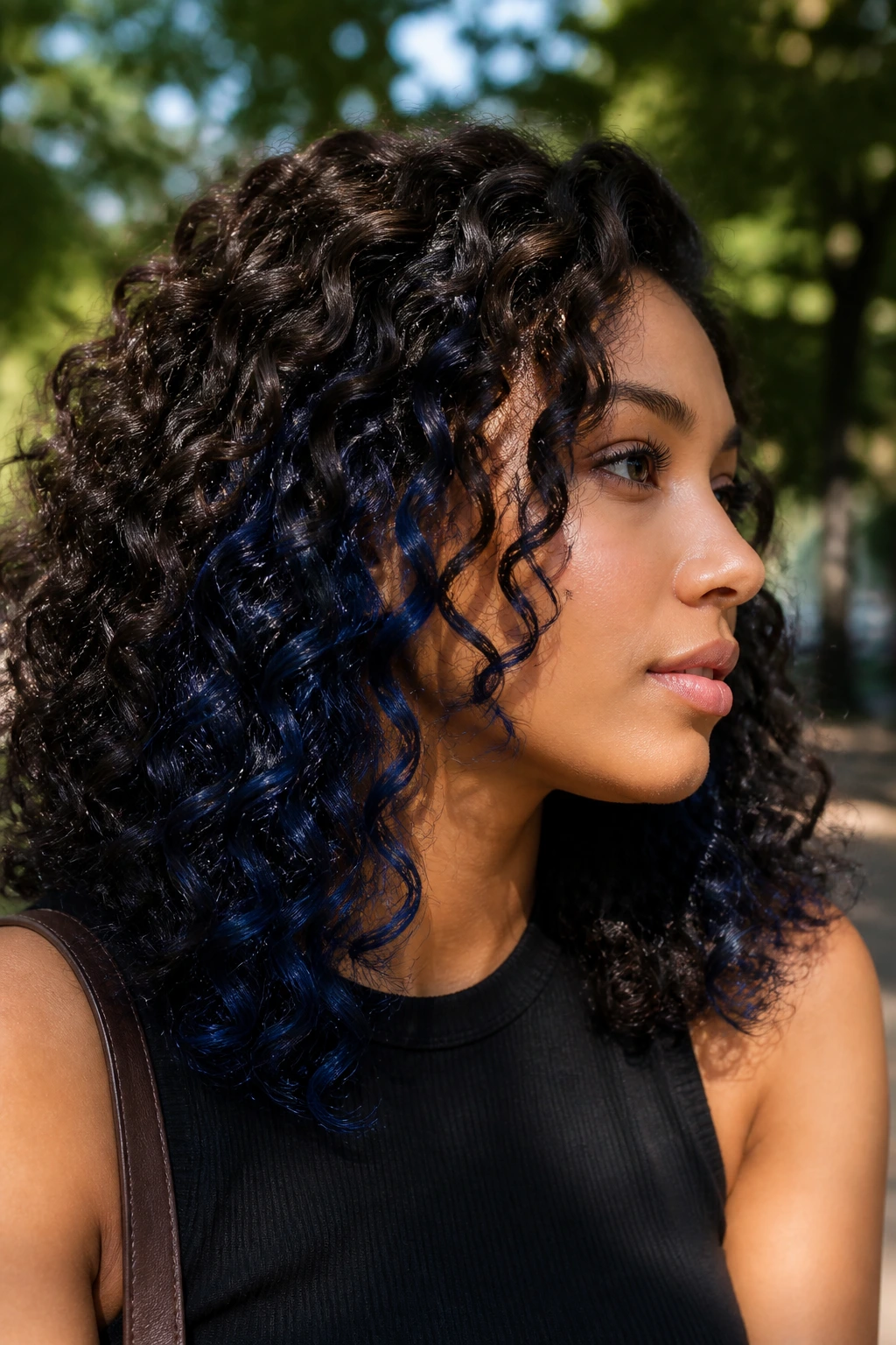 Navy underlayer peeking through curls on a real person