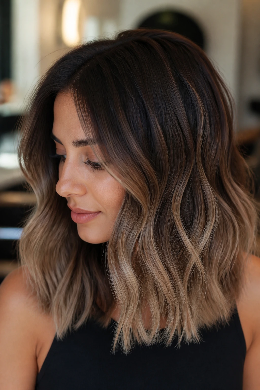 Portrait of brunette with mocha balayage and beige ends