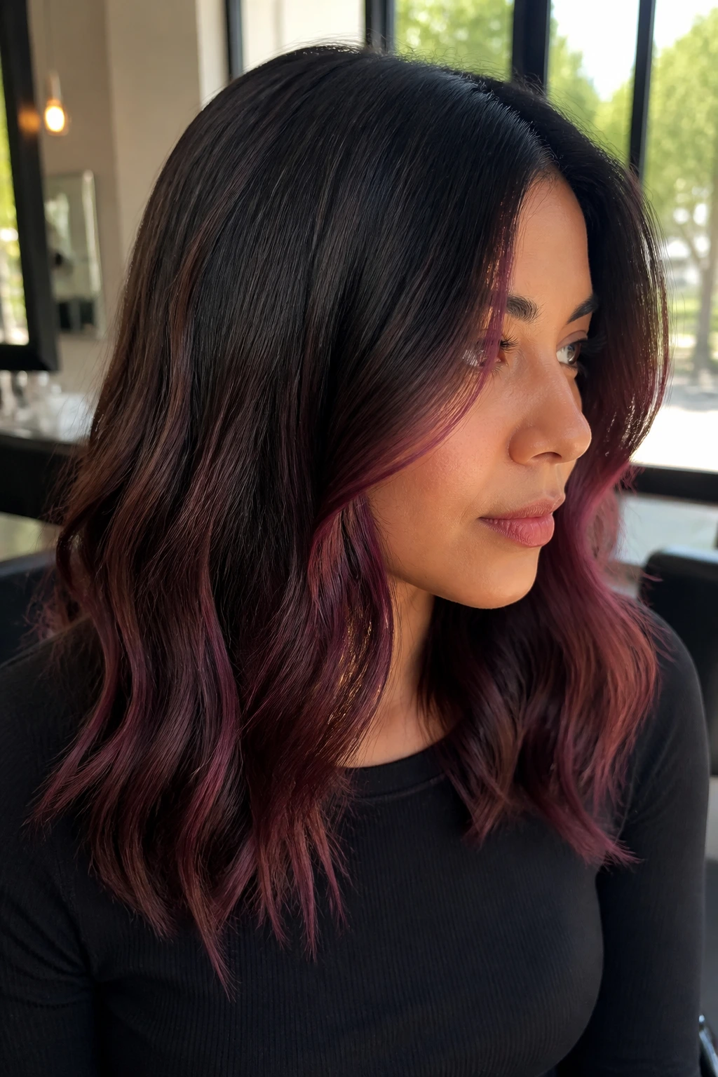 Dark brown hair with mulberry balayage visible around the face