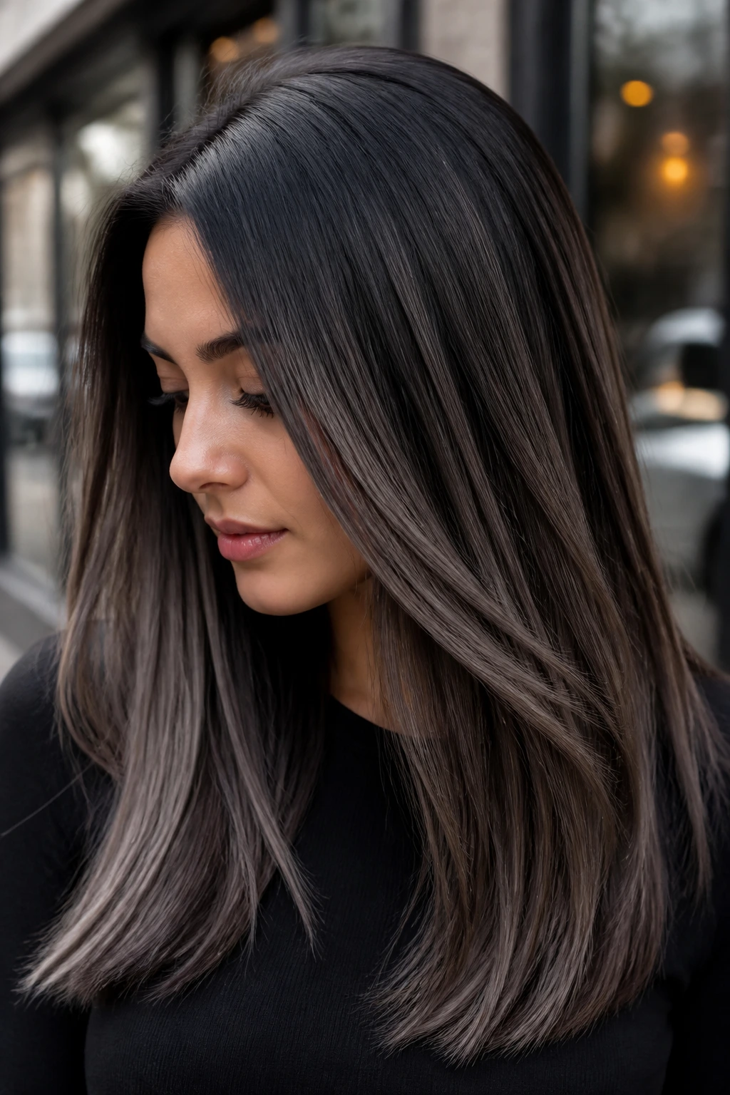 Close-up of straight hair in cool mushroom brown and black blend