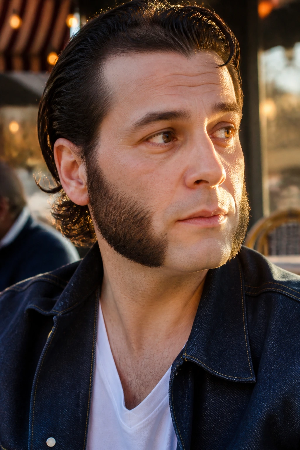 Close-up of a man with thick sideburns and clean chin