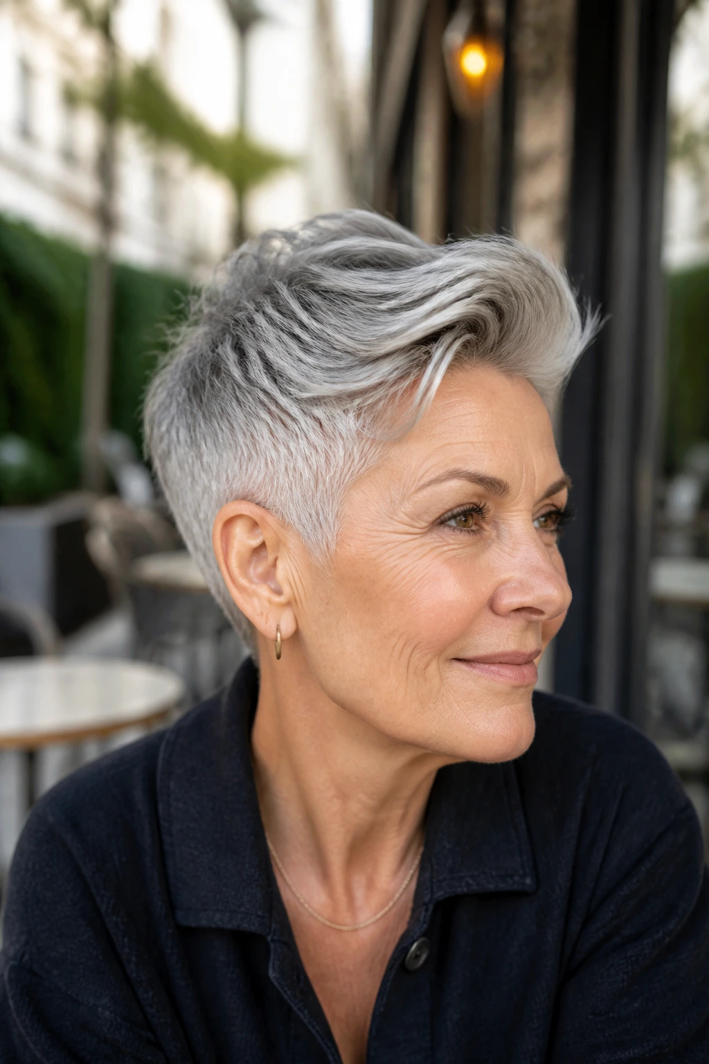 Close-up of a real person with nape-tapered pixie and long top