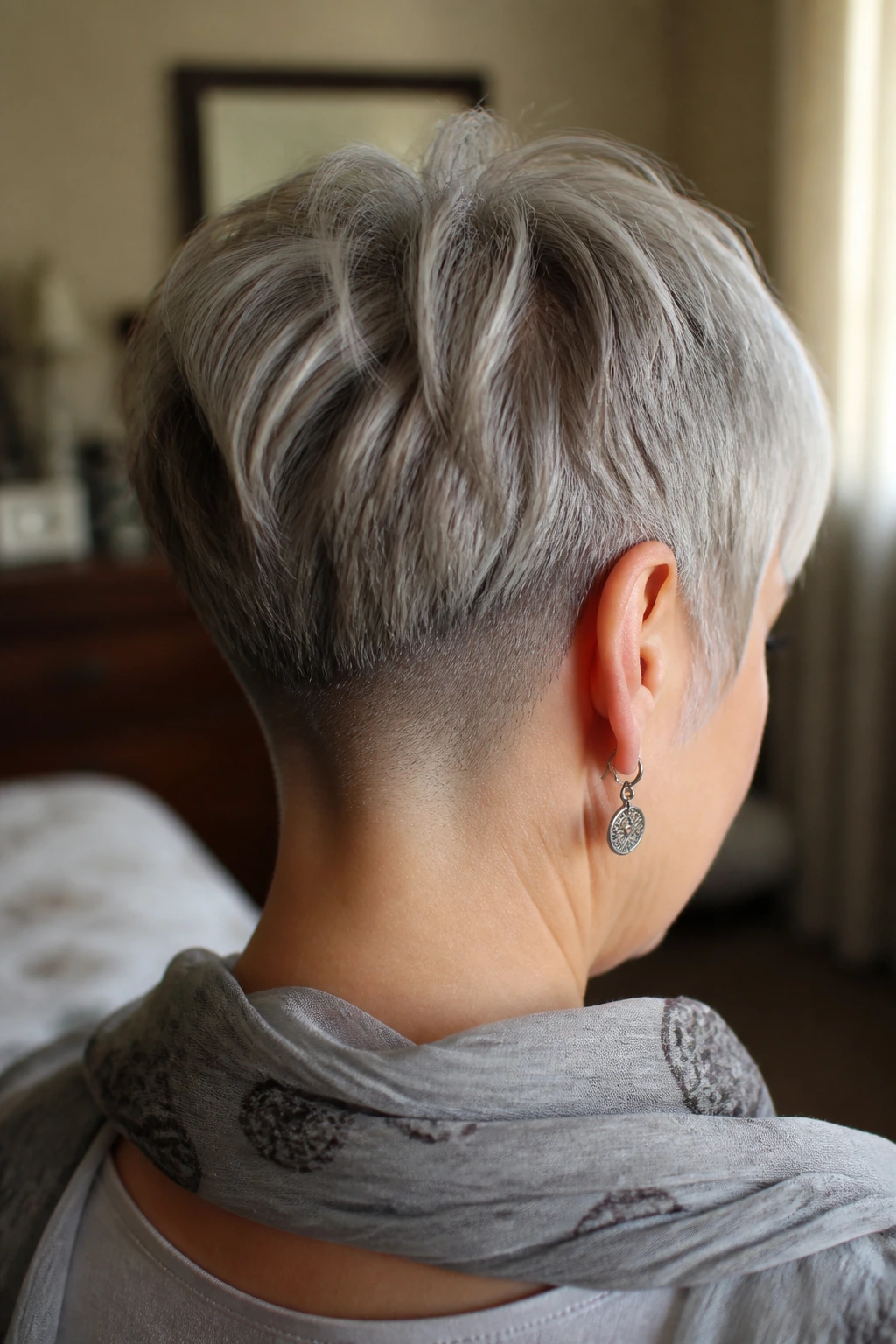 Back view of a real woman's head showing a hidden nape undercut