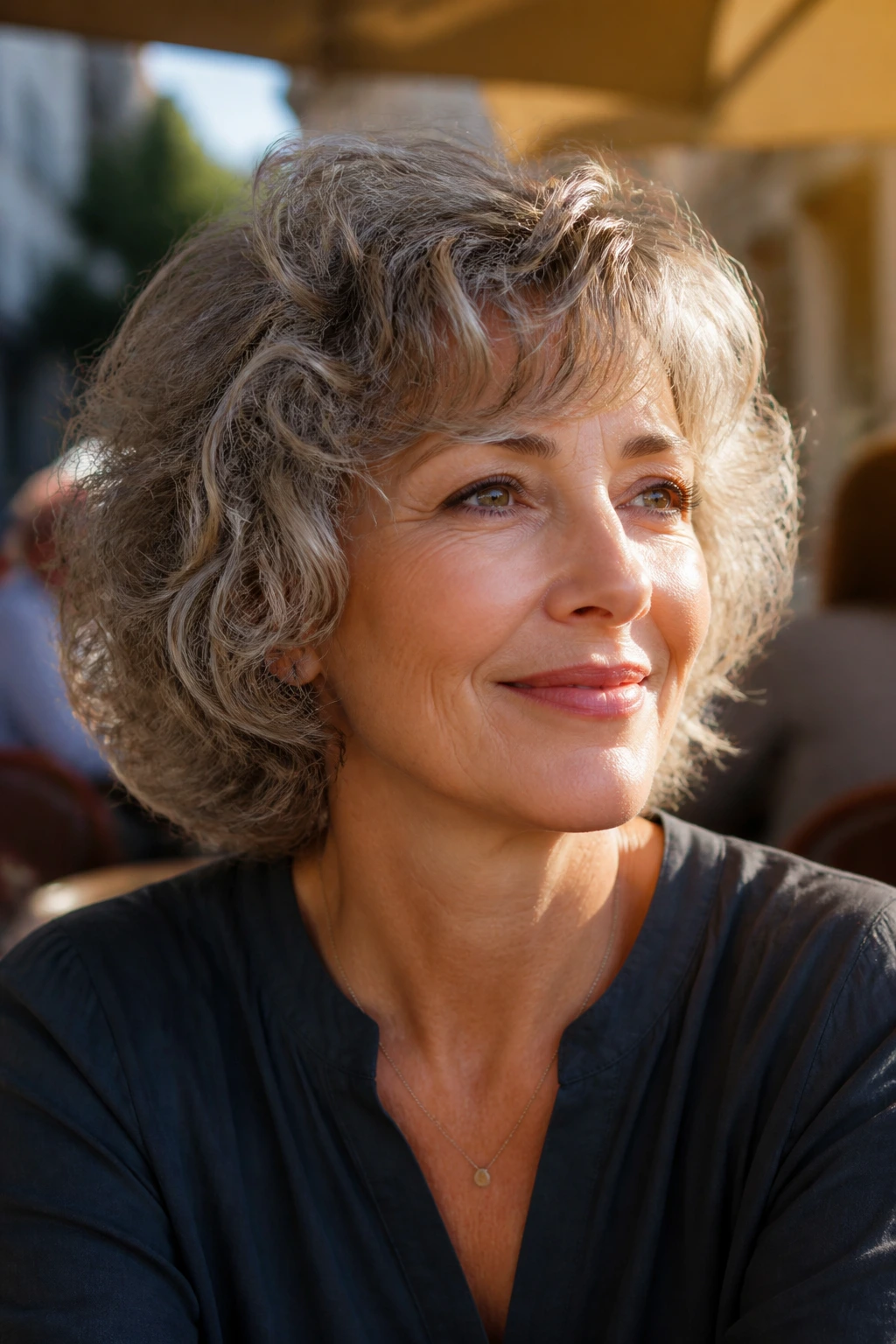 Portrait of a woman with neck-length feathered perm in outdoor light