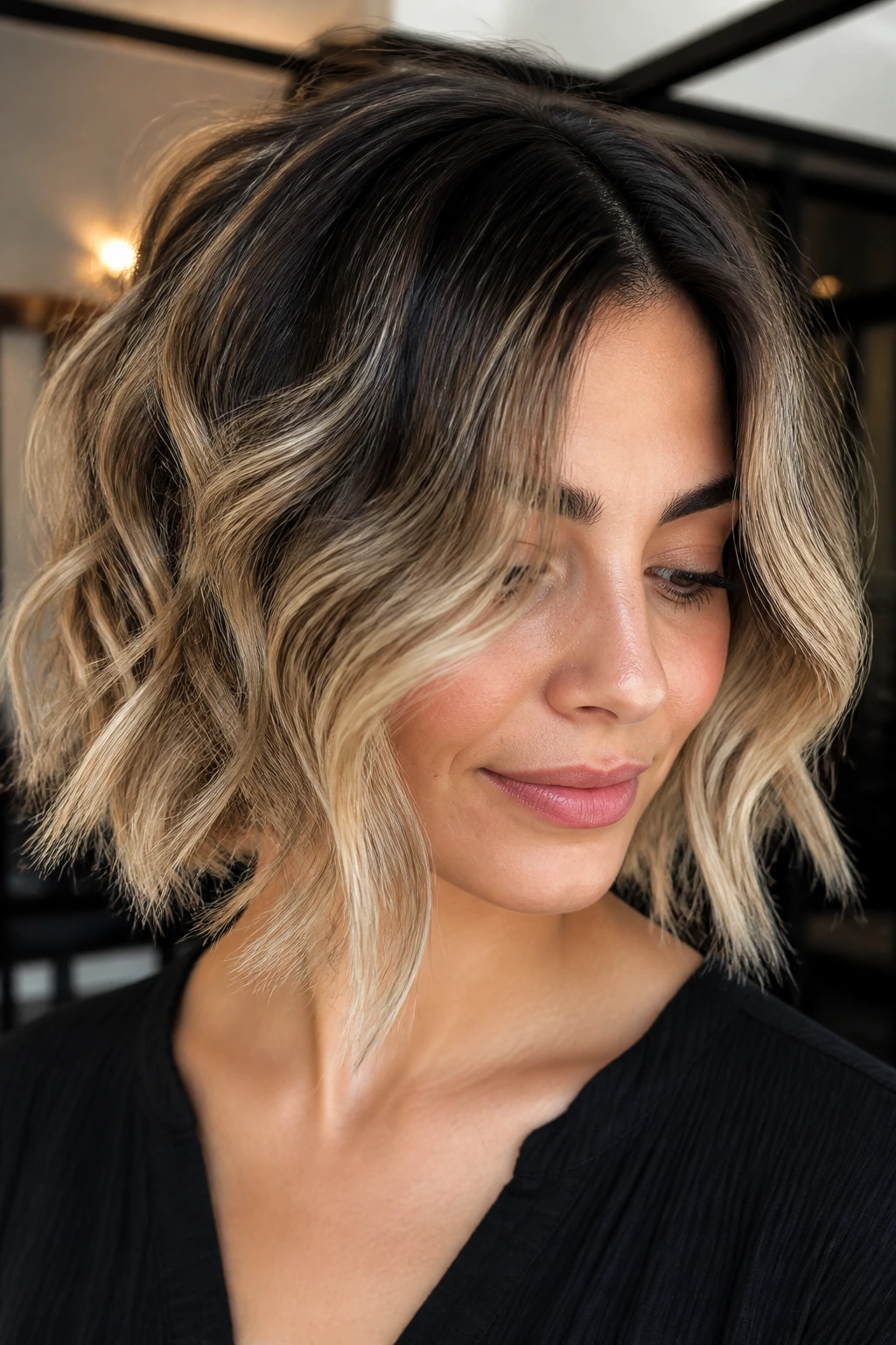 Real woman with soft ombré bob and darker base in bright interior