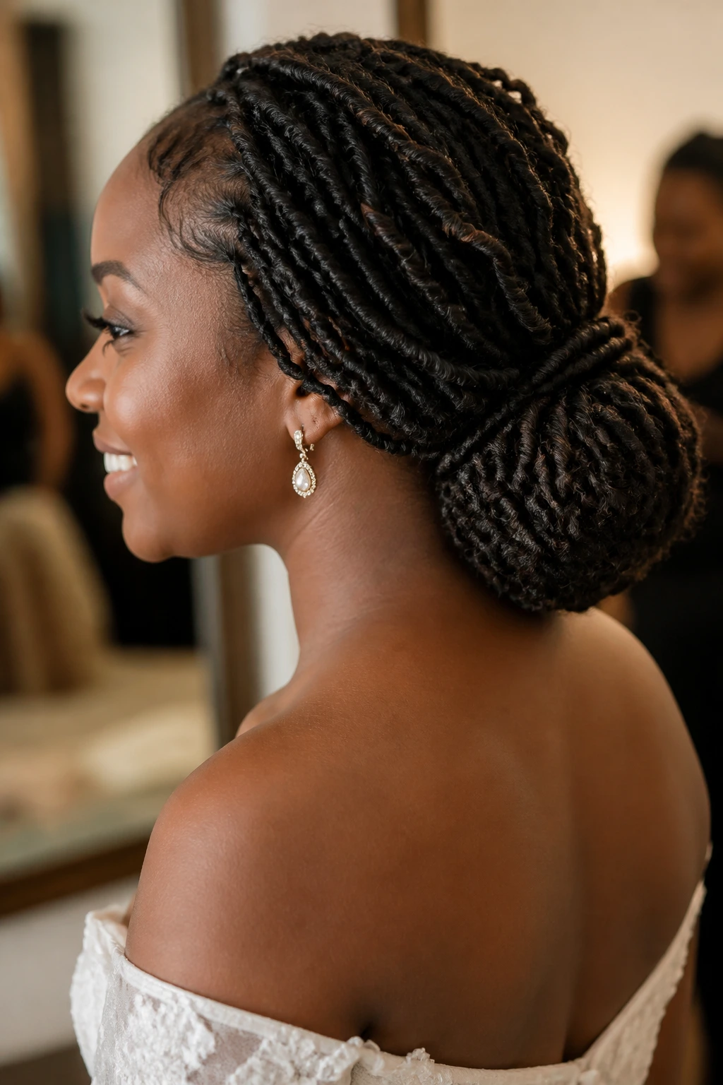 Close-up of passion twists formed into a low chignon at the nape on a real woman