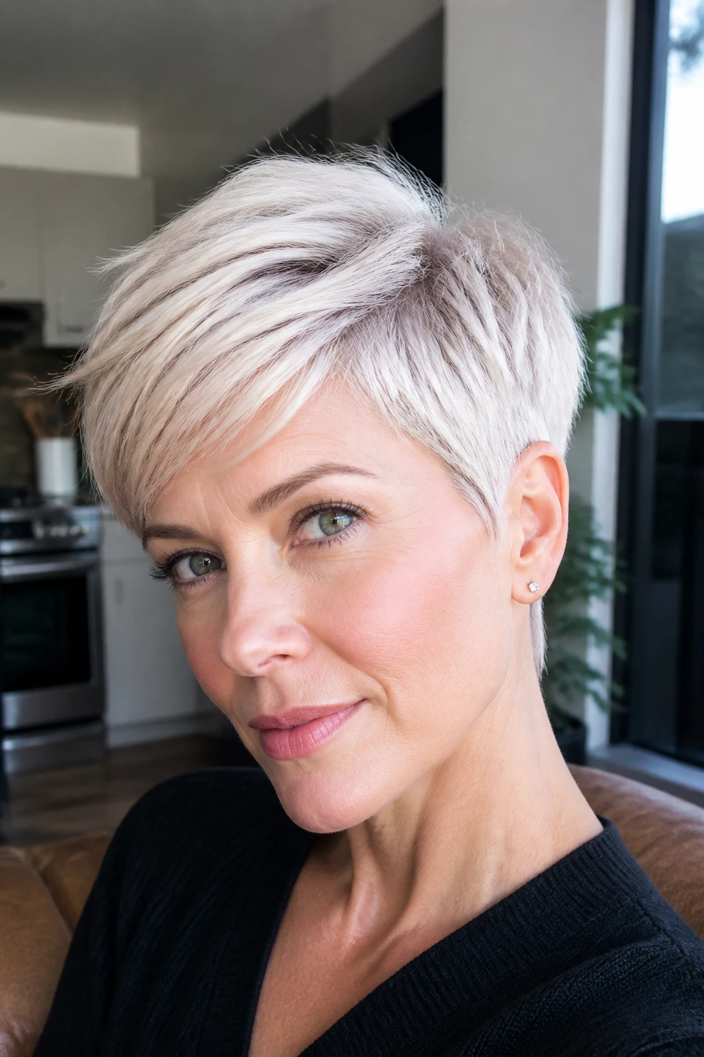 Pearl-platinum pixie cut on a real woman in soft daylight