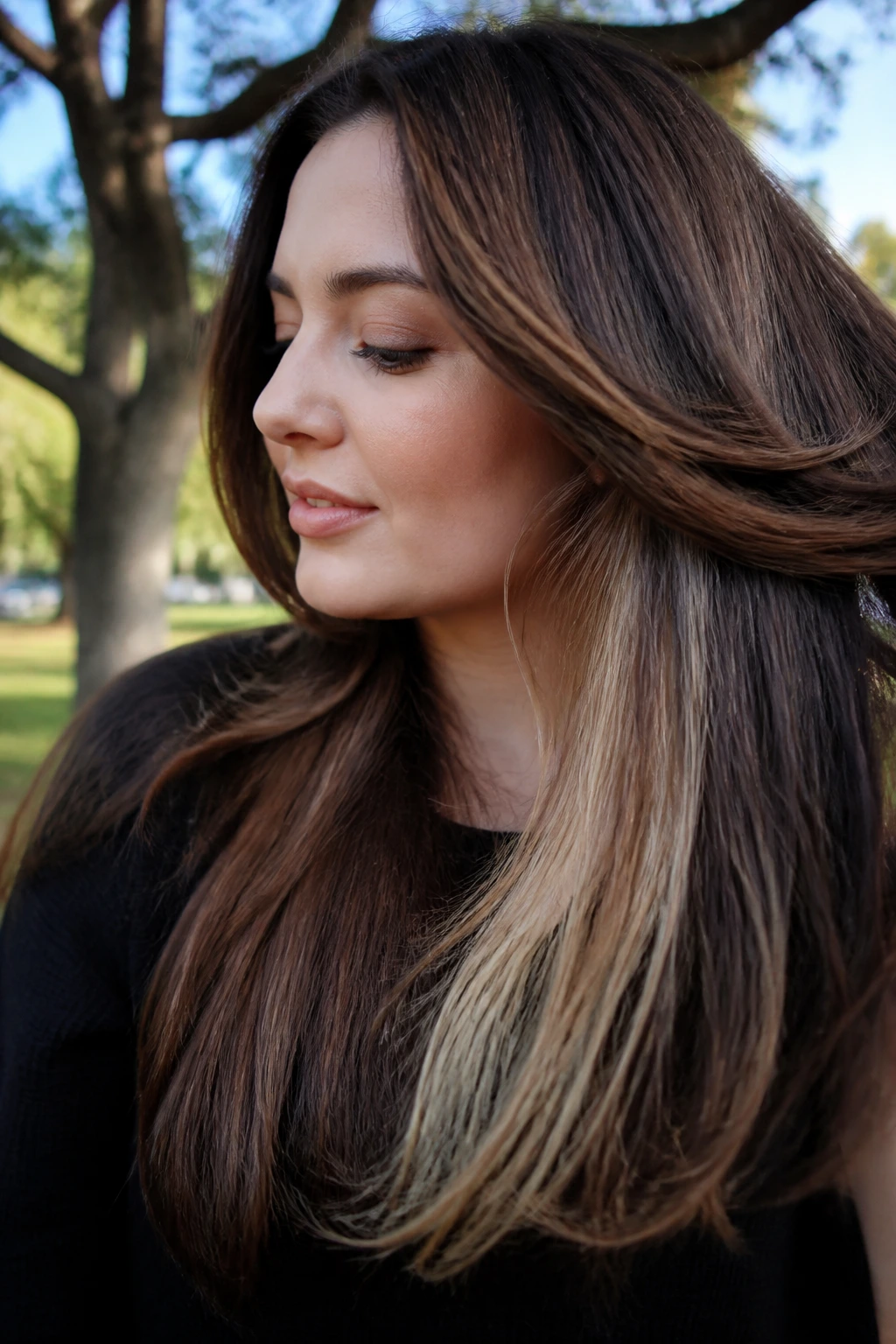 Peekaboo color revealed under top layer in real hair