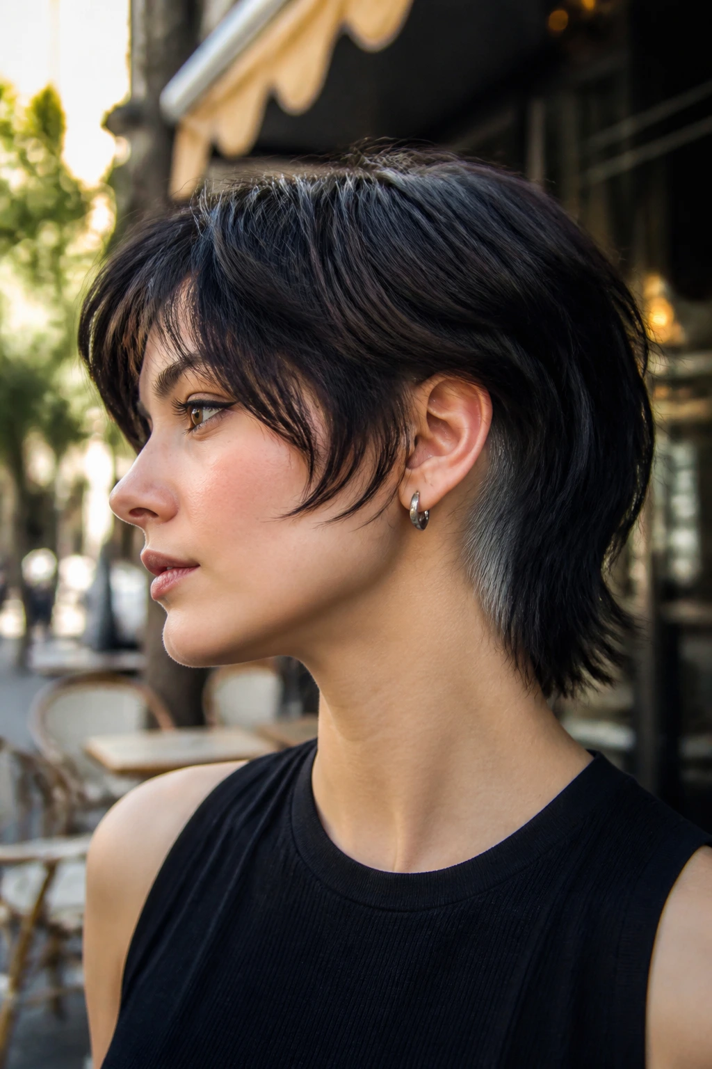 Close-up of a real person with a wolf cut and a peekaboo undercut visible at the sides