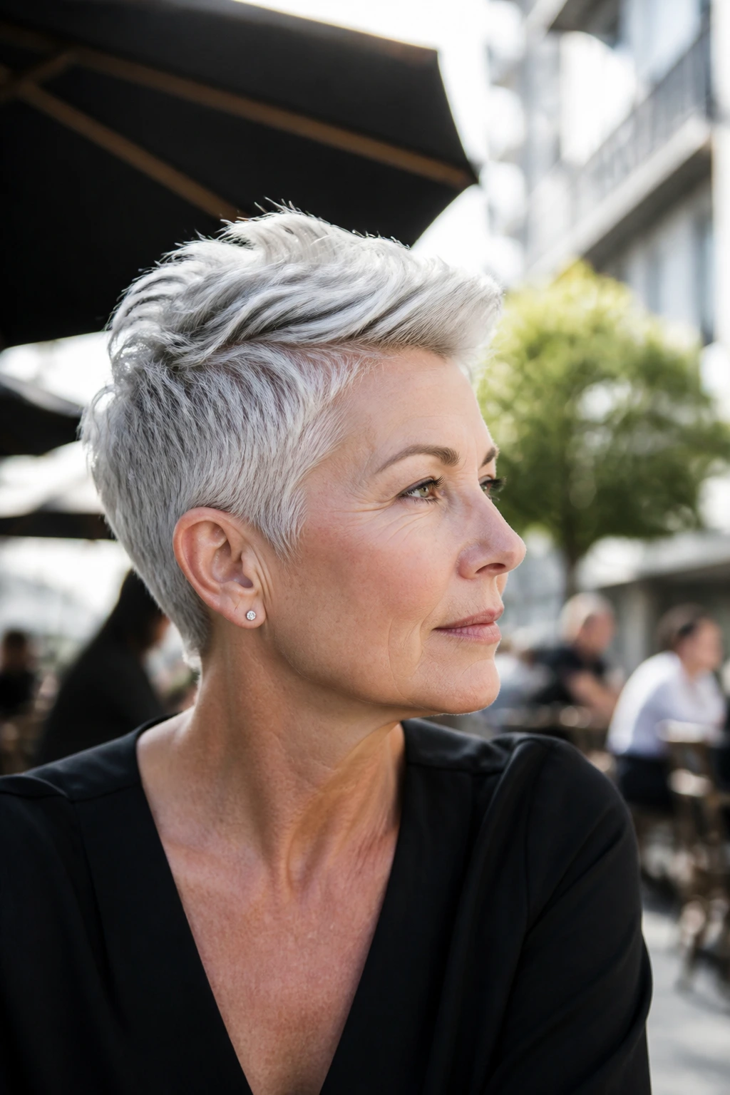 Portrait of a woman with long-top short-sides pixie and high-contrast top
