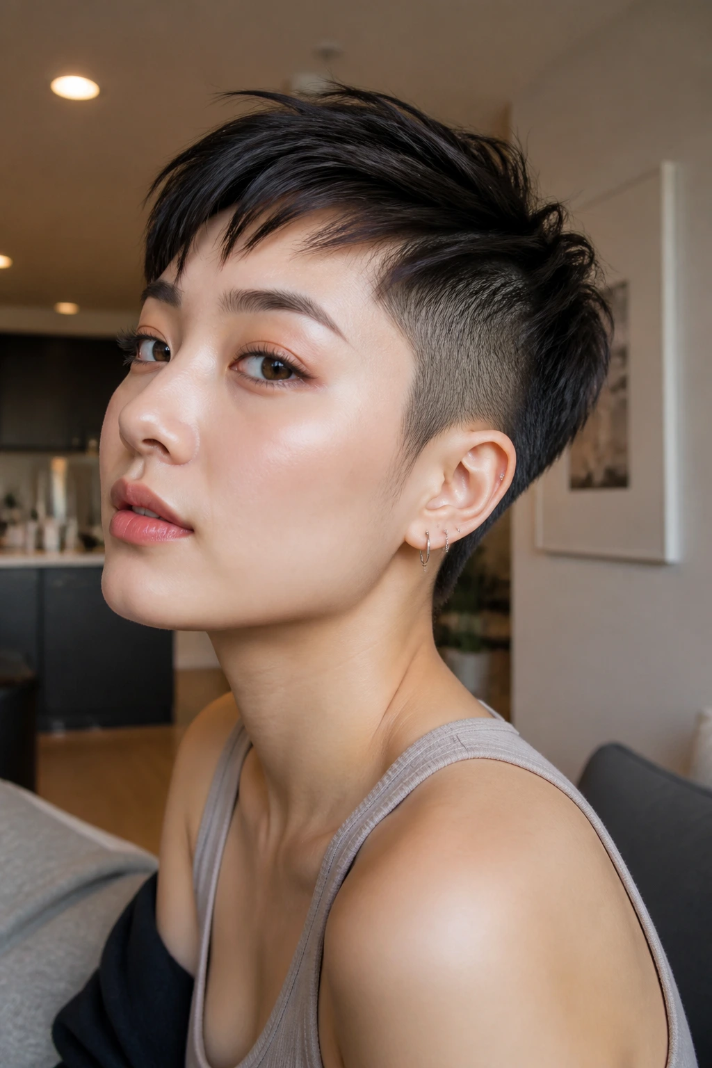 Close-up portrait of pixie cut with shaved sides on a real person